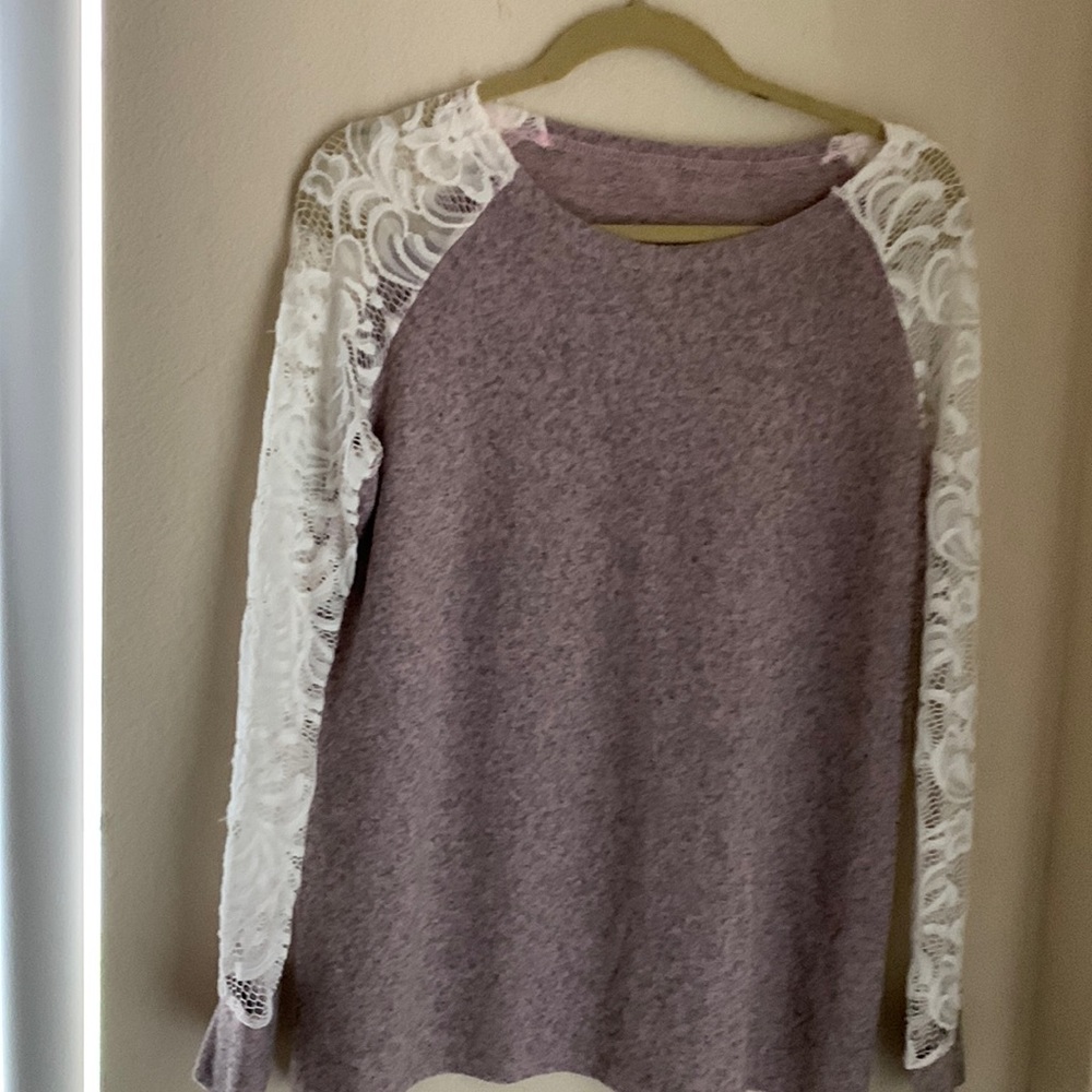 Top with light purple center of top, lace sleeves in white, and cuff lt. purple